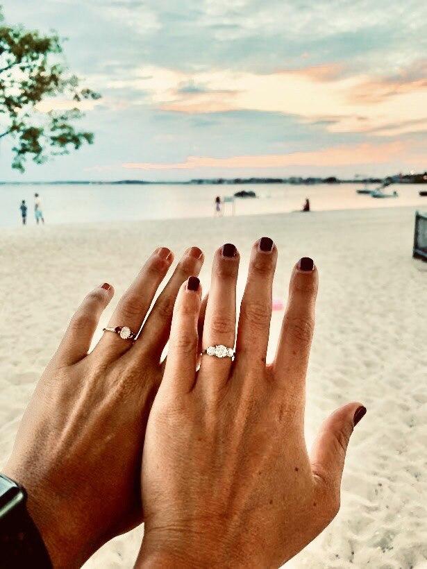 two women hands with rings