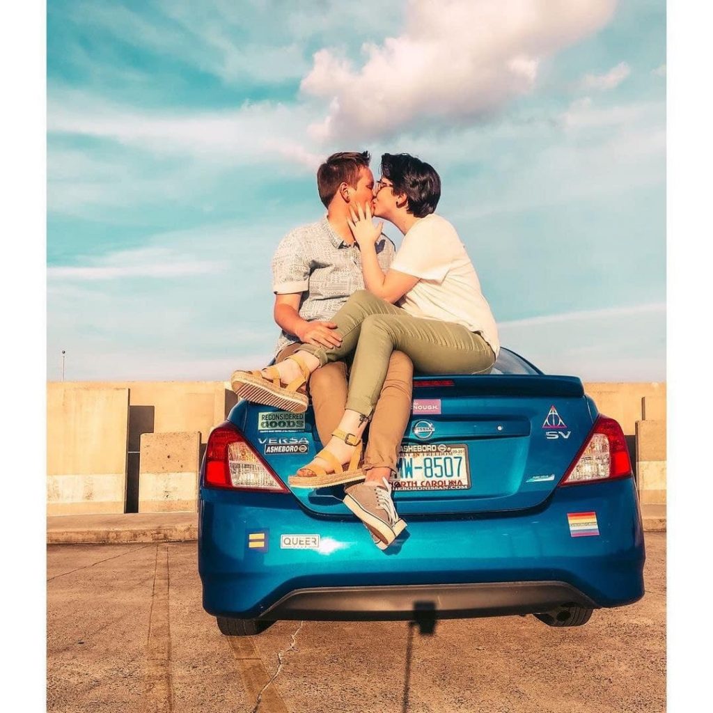 lesbians kissing on the car