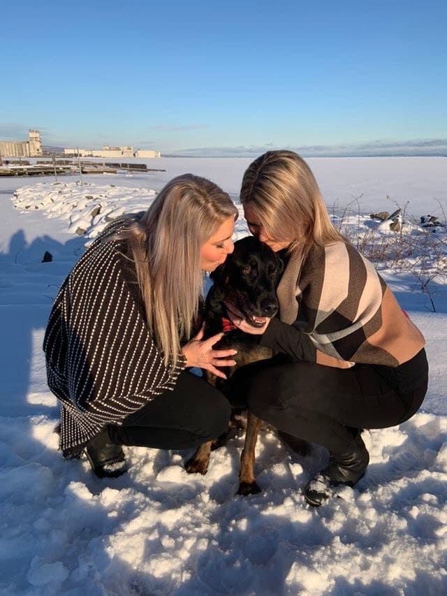 two women and dog