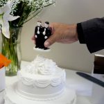 Wedding cake with two dolls of men