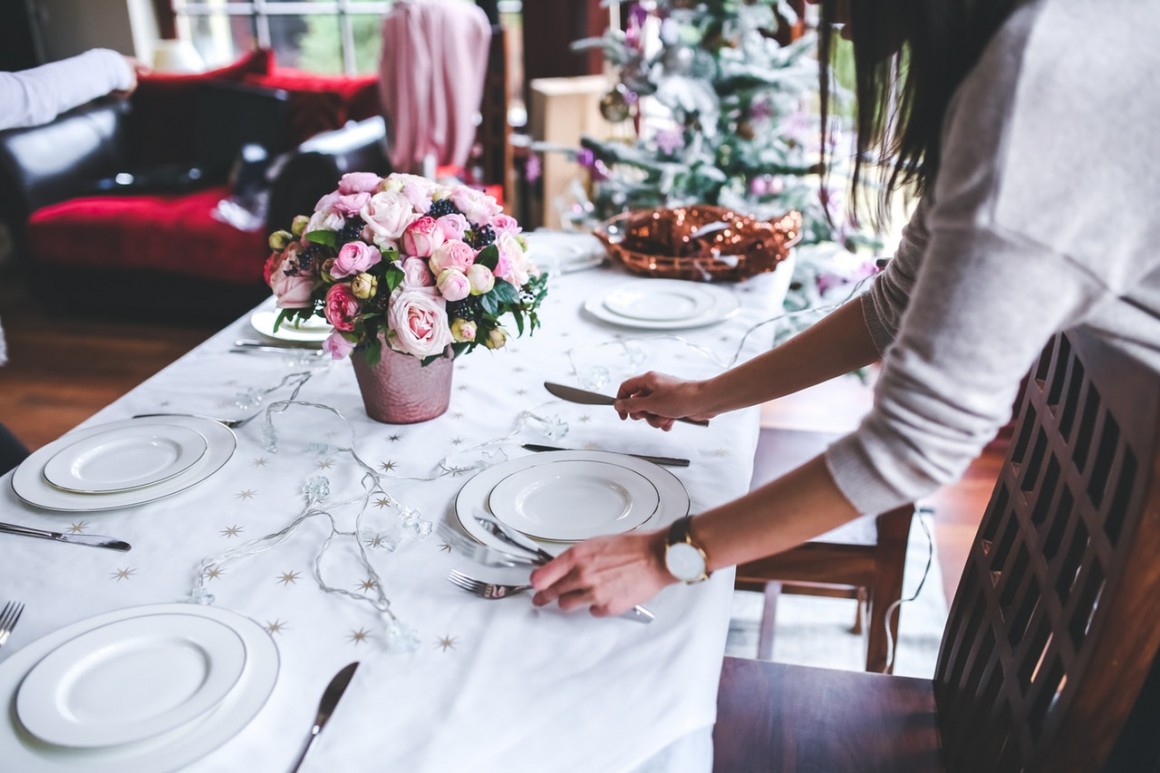 Wedding planner decorate a table