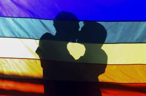 Rainbow flag, two men kissing