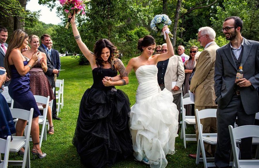 two brides wearng black and white dresses