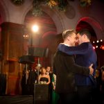 Gay couple dancing at wedding