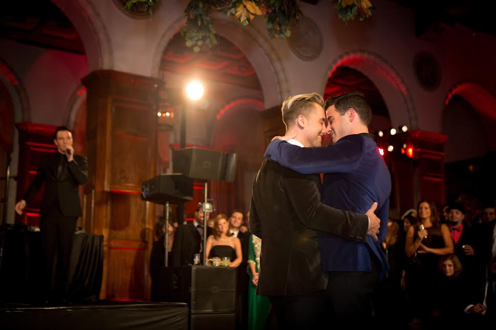 Gay couple dancing at wedding